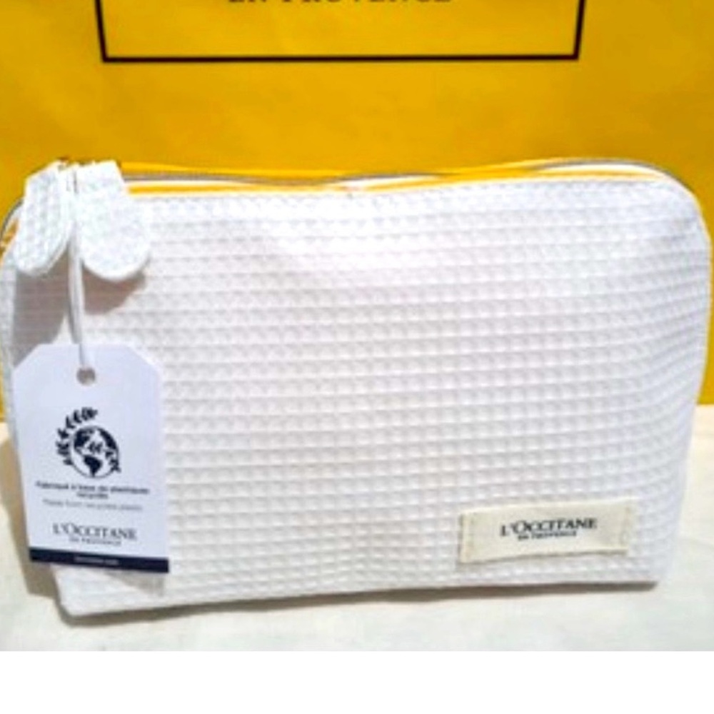 NWT L'Occitane en Provence Cosmetic bag with several samples/trial sizes.